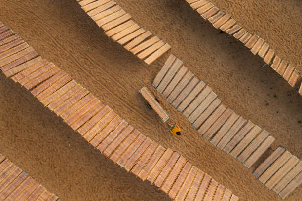 Drone view of rice paper drying in a traditional village of dry vermicelli and rice paper in Nhon Phuc Commune, An Nhon Town, in the south central coastal province of Binh Dinh, is over 100 years old.